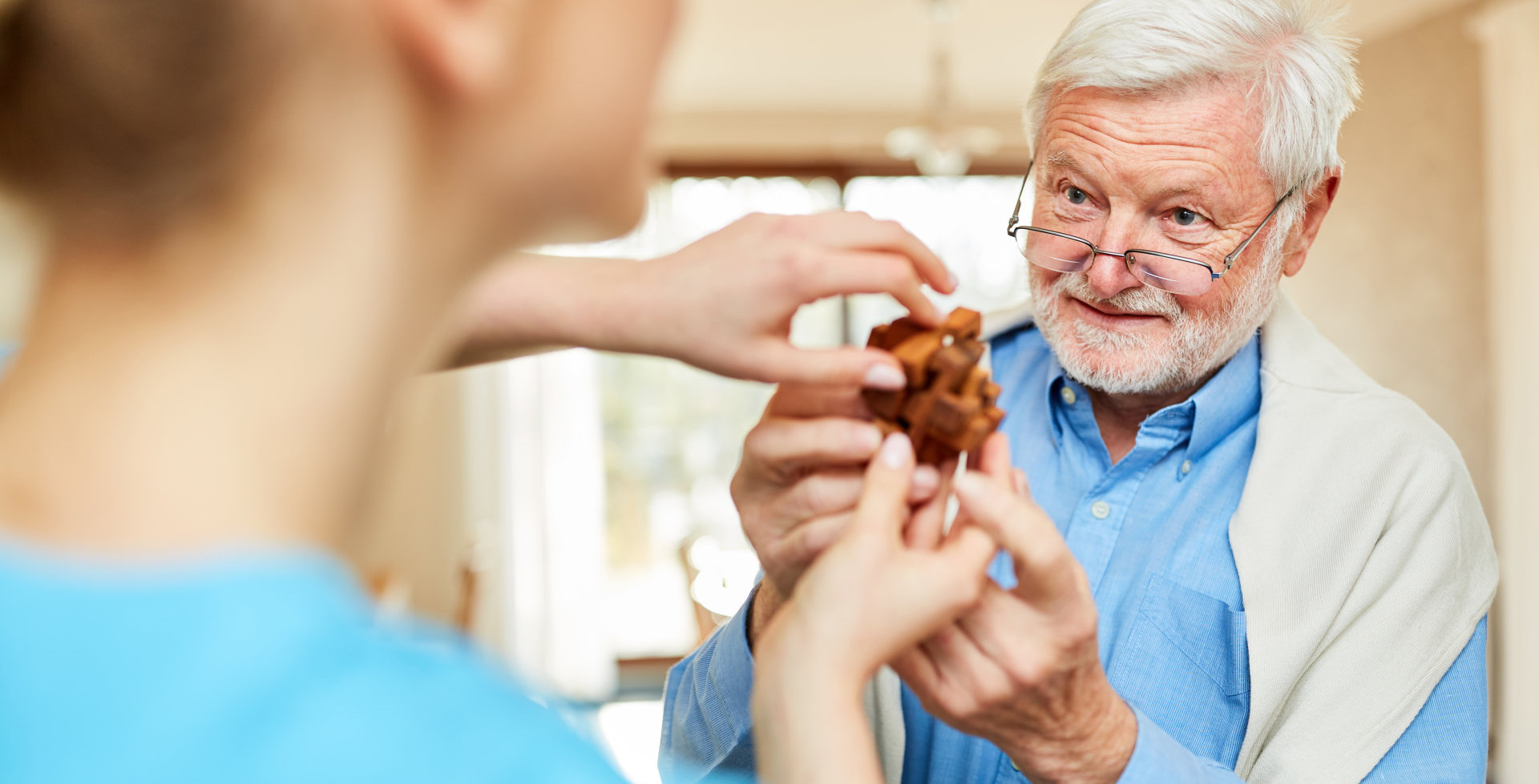 Nursing lady looks after senior man